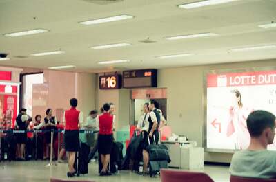 Korean Air staff and passengers at gate 16 — Seoul, in transit (August 2000)