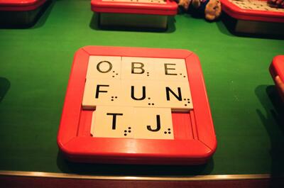 Giant Scrabble tiles spelling words in the play zone — London, England (August 2000)