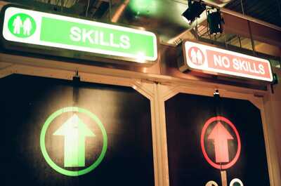 Glowing 'Skills' and 'No Skills' entrance signs — London, England (August 2000)