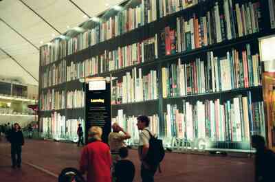 A towering wall of books in the Learning zone — London, England (August 2000)