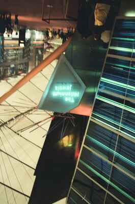 The Millennium Jewels exhibit sign above an escalator — London, England (August 2000)