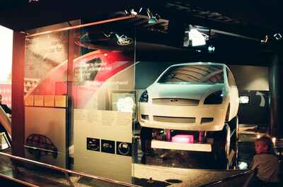 A Ford concept car raised on a display platform — London, England (August 2000)