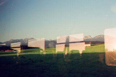 Alpine meadows and peaks seen through a train window — Fussen, Germany (19-21 June 2000)