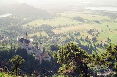 Neuschwanstein Castle above the green valley and lakes — Fussen, Germany (19-21 June 2000)