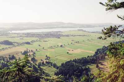 Patchwork fields and a lake seen from a high viewpoint — Fussen, Germany (19-21 June 2000)