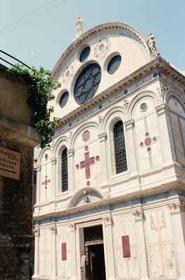Ornate marble Gothic church facade with rose window — Venice, Italy (7-10 June 2000)
