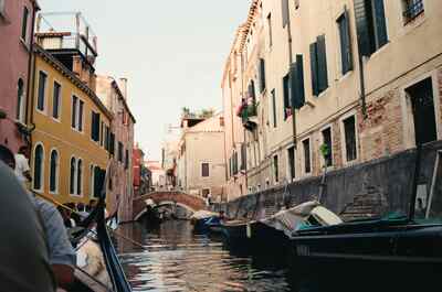 A gondola gliding down a narrow side canal — Venice, Italy (7-10 June 2000)