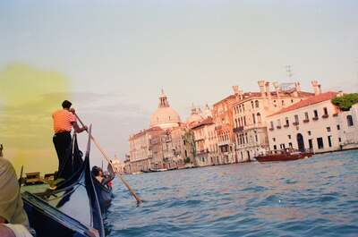 Gondolier rowing past the dome of Santa Maria della Salute — Venice, Italy (7-10 June 2000)