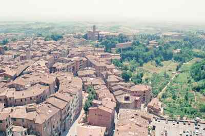 Terracotta rooftops of Siena and the Tuscan countryside — Siena, Italy (4-6 June 2000)
