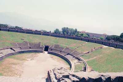 Grassy tiers of the Pompeii amphitheatre below the mountains — Pompeii, Italy (4-6 June 2000)