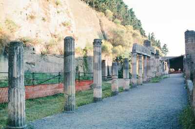 Columns of the Pompeii forum with Vesuvius behind — Pompeii, Italy (4-6 June 2000)