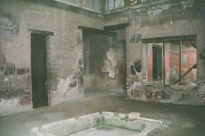 A faded frescoed room with central pool at Pompeii — Pompeii, Italy (4-6 June 2000)