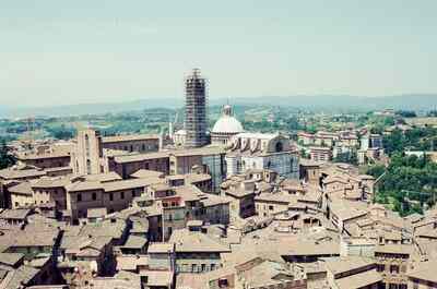 Siena's striped cathedral above the city rooftops — Siena, Italy (6-10 June 2000)