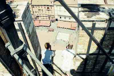 Two men photographing Piazza del Campo from the tower top — Siena, Italy (6-10 June 2000)
