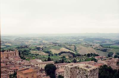 Rooftops of San Gimignano below the Tuscan hills — San Gimignano, Italy (6-10 June 2000)