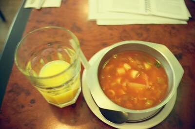 A bowl of vegetable soup and orange juice at a cafe — England, England (August 2000)