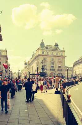 Crowds on a sunny plaza before a white-domed building — London, England (August 2000)
