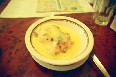 A bowl of chicken in creamy sauce at a cafe — England, England (August 2000)