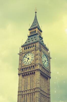Big Ben's clock tower against a pale sky — London, England (August 2000)