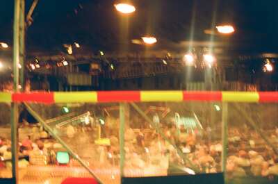 Bright stage lights at a circus arena at night — London, England (August 2000)