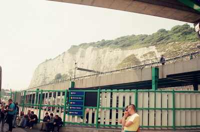Travellers waiting below the White Cliffs at the ferry terminal — Dover, England (13-20 July 2000)
