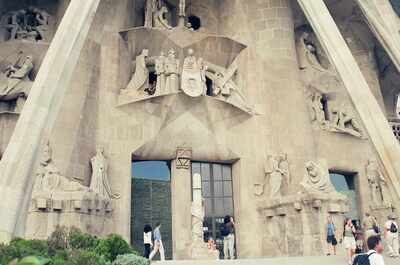 Tourists below the Passion facade of the Sagrada Familia — Barcelona, Spain (13-20 July 2000)