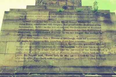 The weathered inscription on the John Knox Monument plinth — Glasgow, Scotland (late July 2000)