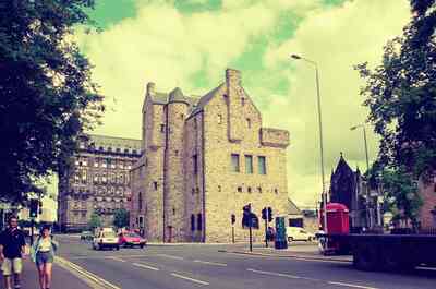 A stone tower house and tenements on Cathedral Square — Glasgow, Scotland (late July 2000)