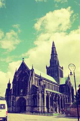 The spire and tower of Glasgow Cathedral against billowing clouds — Glasgow, Scotland (late July 2000)