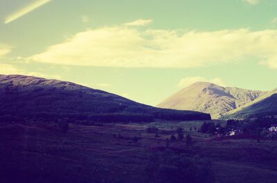 Rolling green hills and a glen on the route to Oban — Oban, Scotland (late July 2000)
