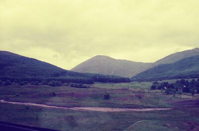 A green glen between Highland hills from the train — Scottish Highlands, Scotland (late July 2000)