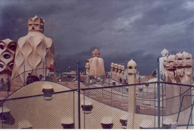 The rooftop chimneys of Casa Mila under a storm sky — Barcelona, Spain (13-20 July 2000)